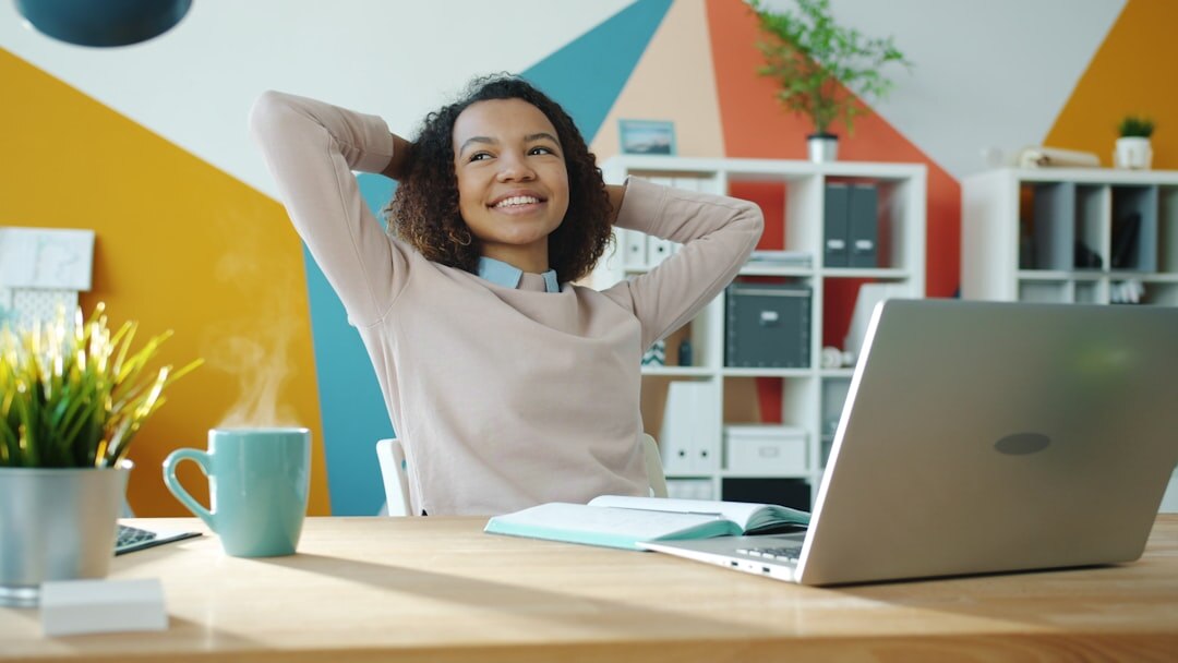 Friendly person answering messages at a bright desk