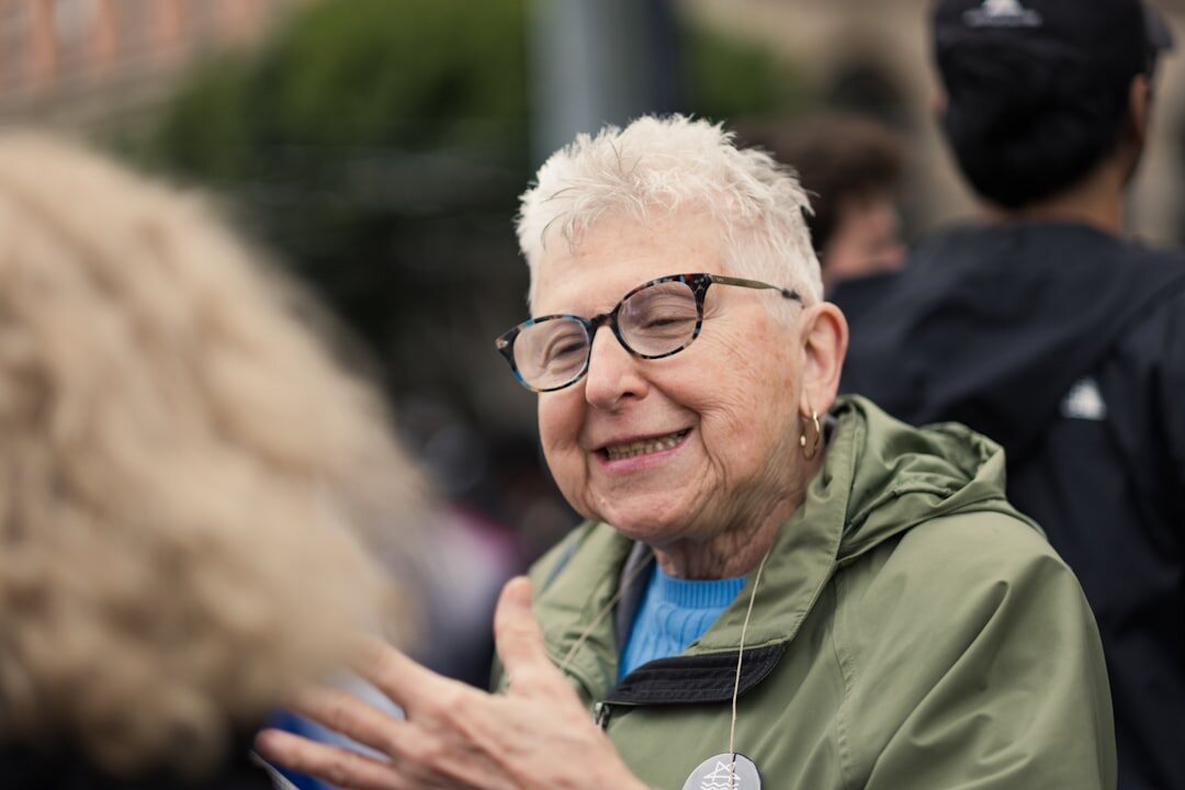 Woman smiling warmly during a conversation