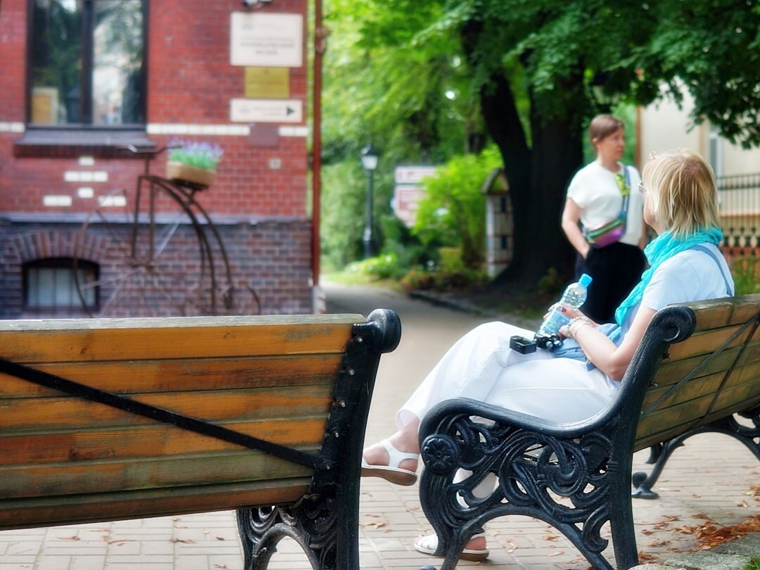 Two people having a calm one on one conversation on a bench